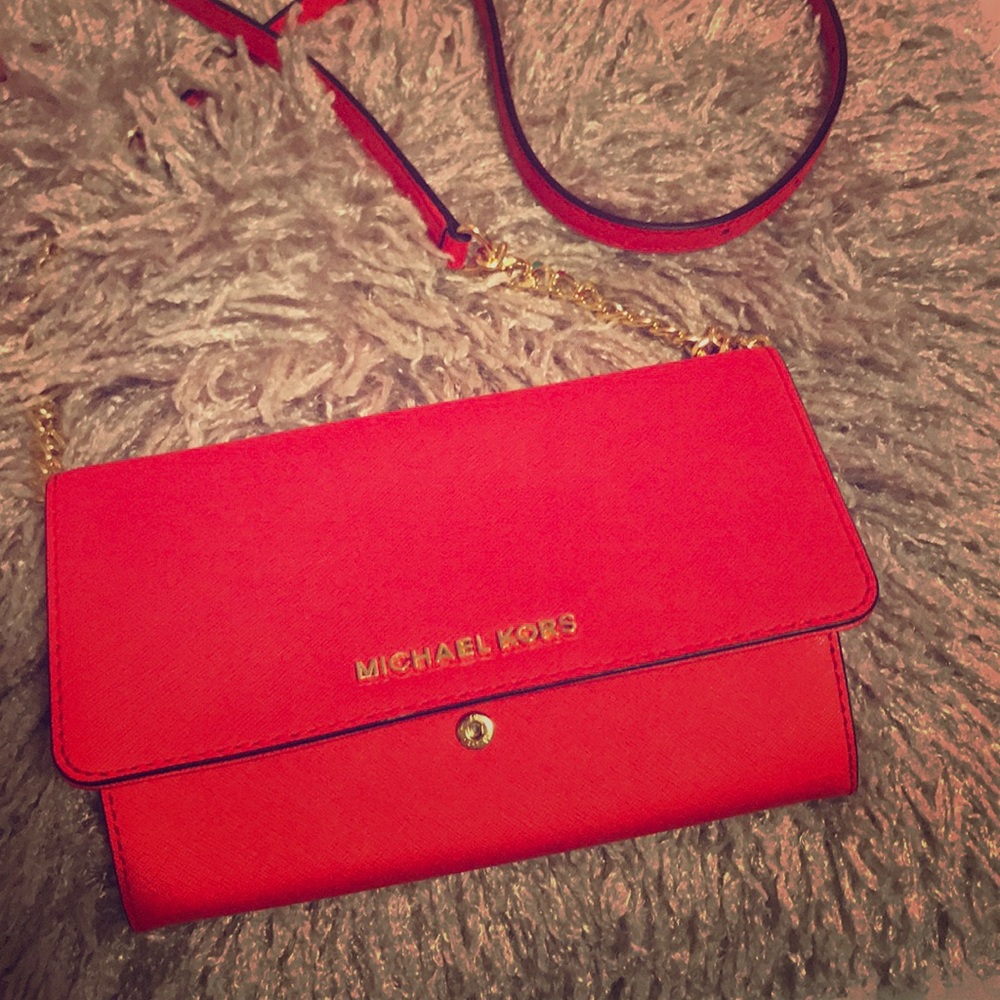 Red Michael Kors cross bag